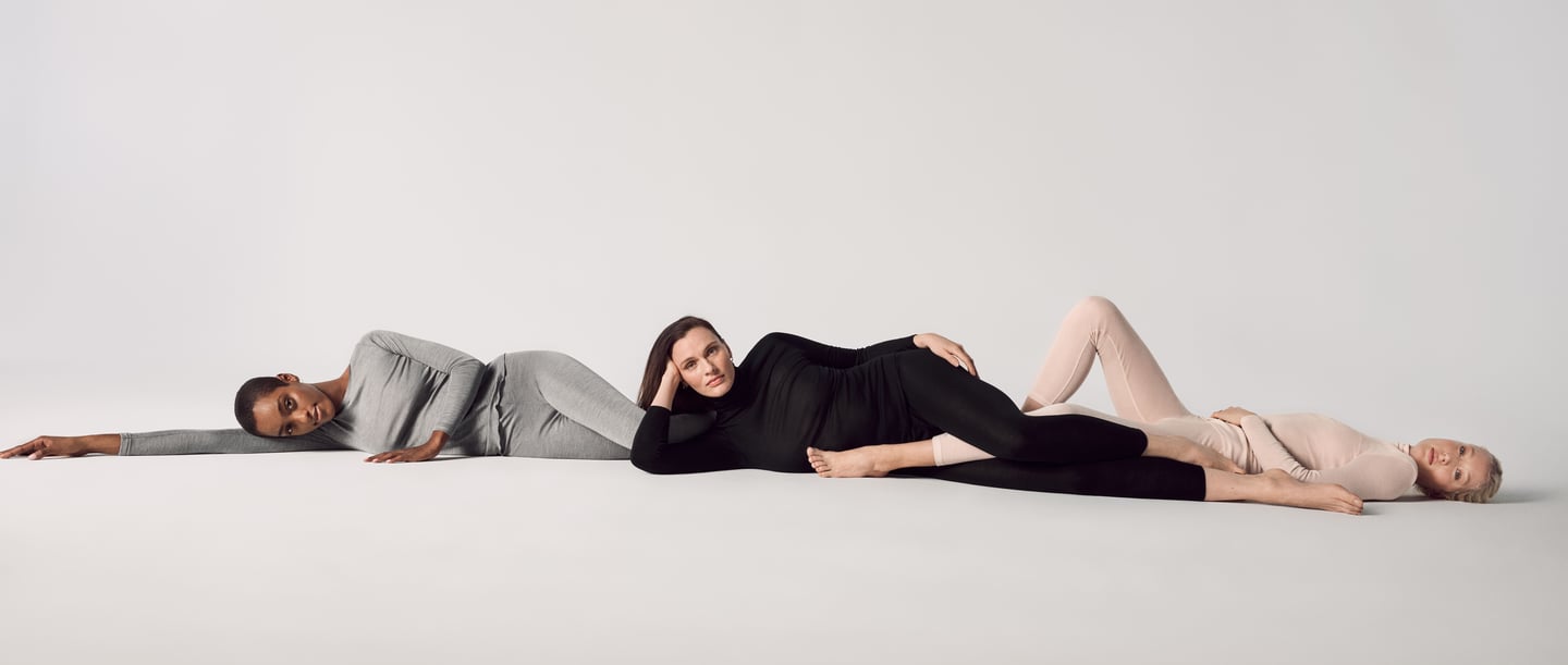 The picture shows three women lying relaxed in Calida clothing.