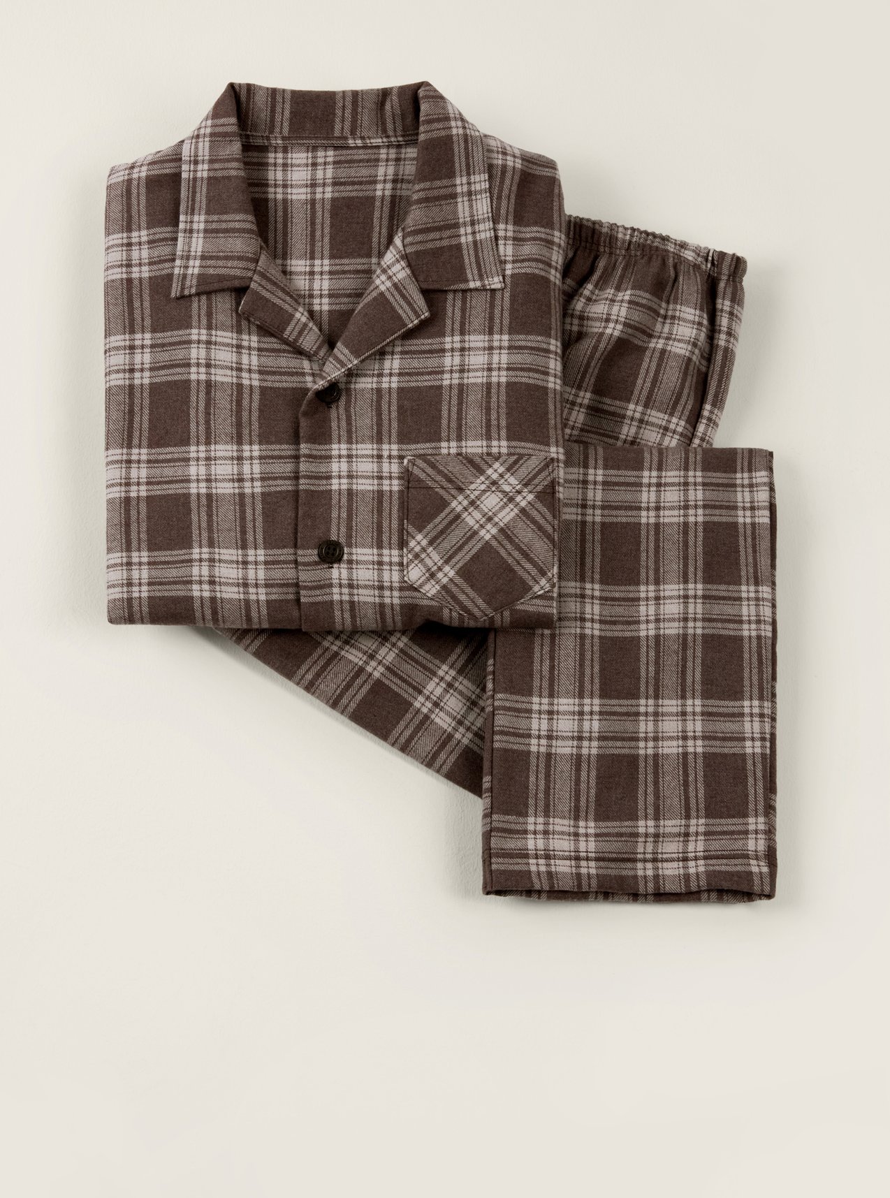 Warming flannel pajamas with a brown checkered pattern, presented as a winter gift idea.