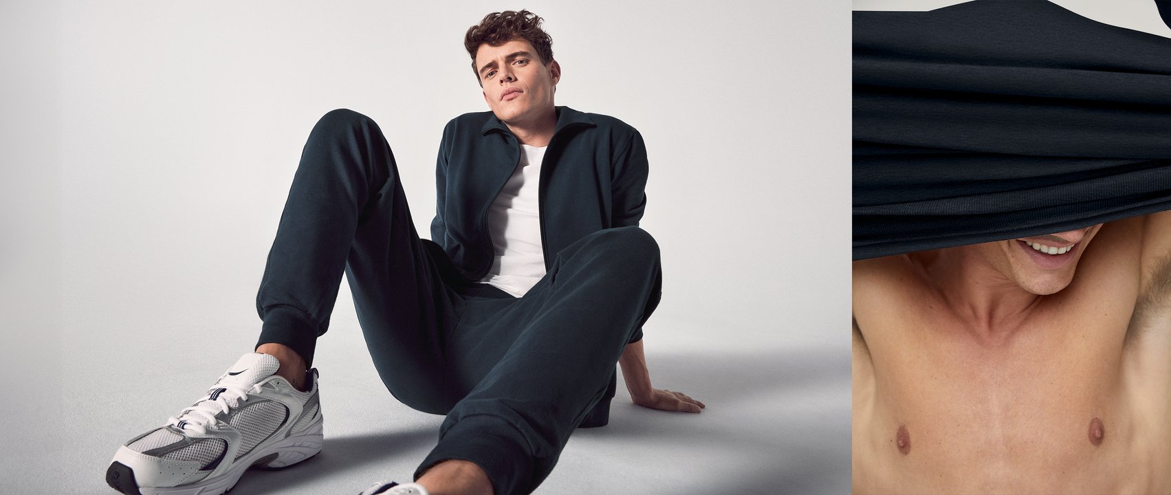 The model is wearing a white shirt from the Cotton Code range, a dark blue jumper and dark blue trousers from the Remix Basic Lounge range.