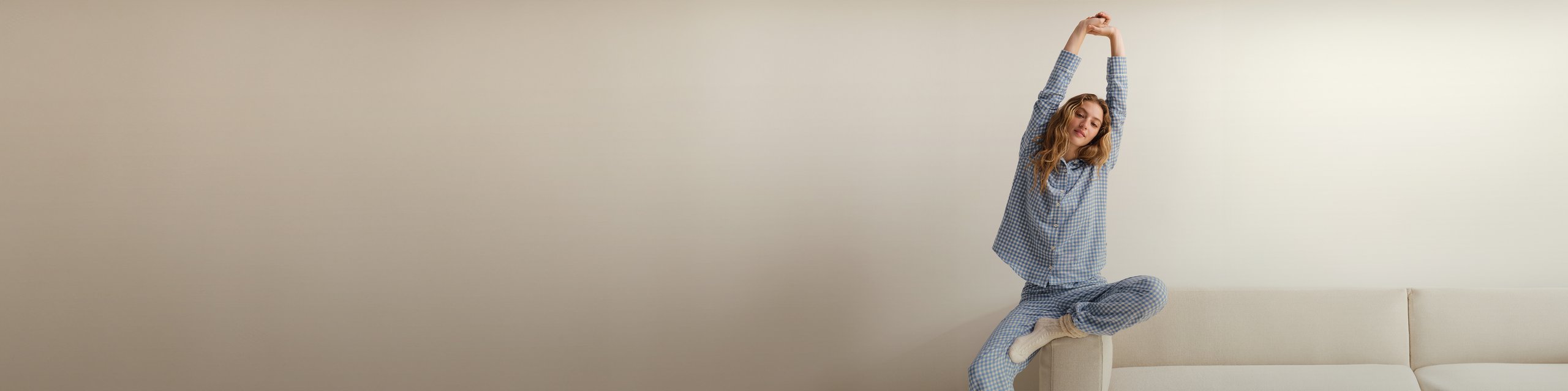 Women and men wear different pajamas from the CALIDA brand.