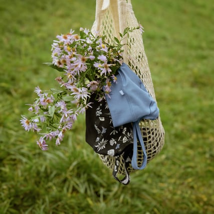 The picture shows two bustiers from the favourite Elastic series, in blue and black with a pattern.