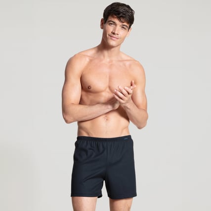The model is wearing blue boxer shorts from the Prints Benefit series.  