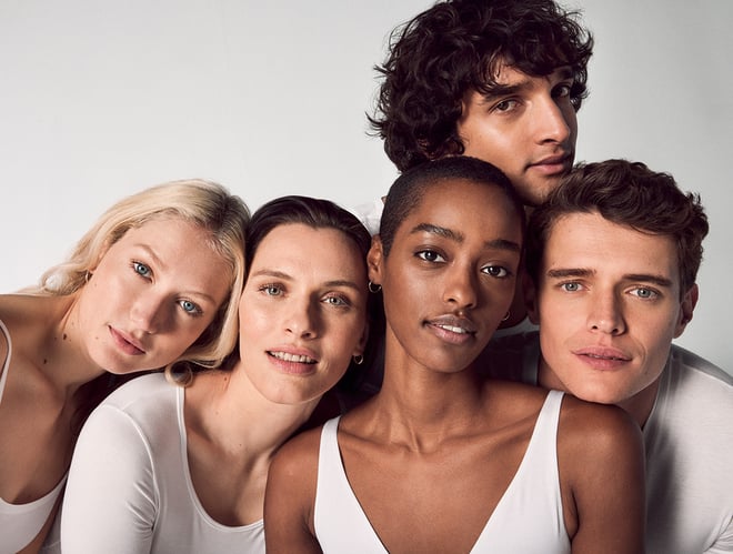 Five models smile into the camera
