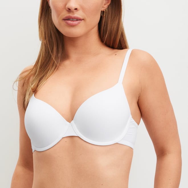 The woman is wearing a underwired bra from the Sleek Skin range in white.