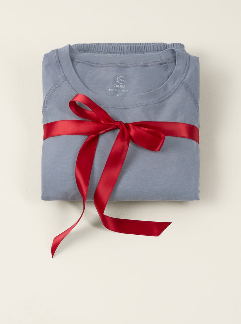 Innovative functional underwear in light blue, presented with a ribbon as a stylish gift idea.