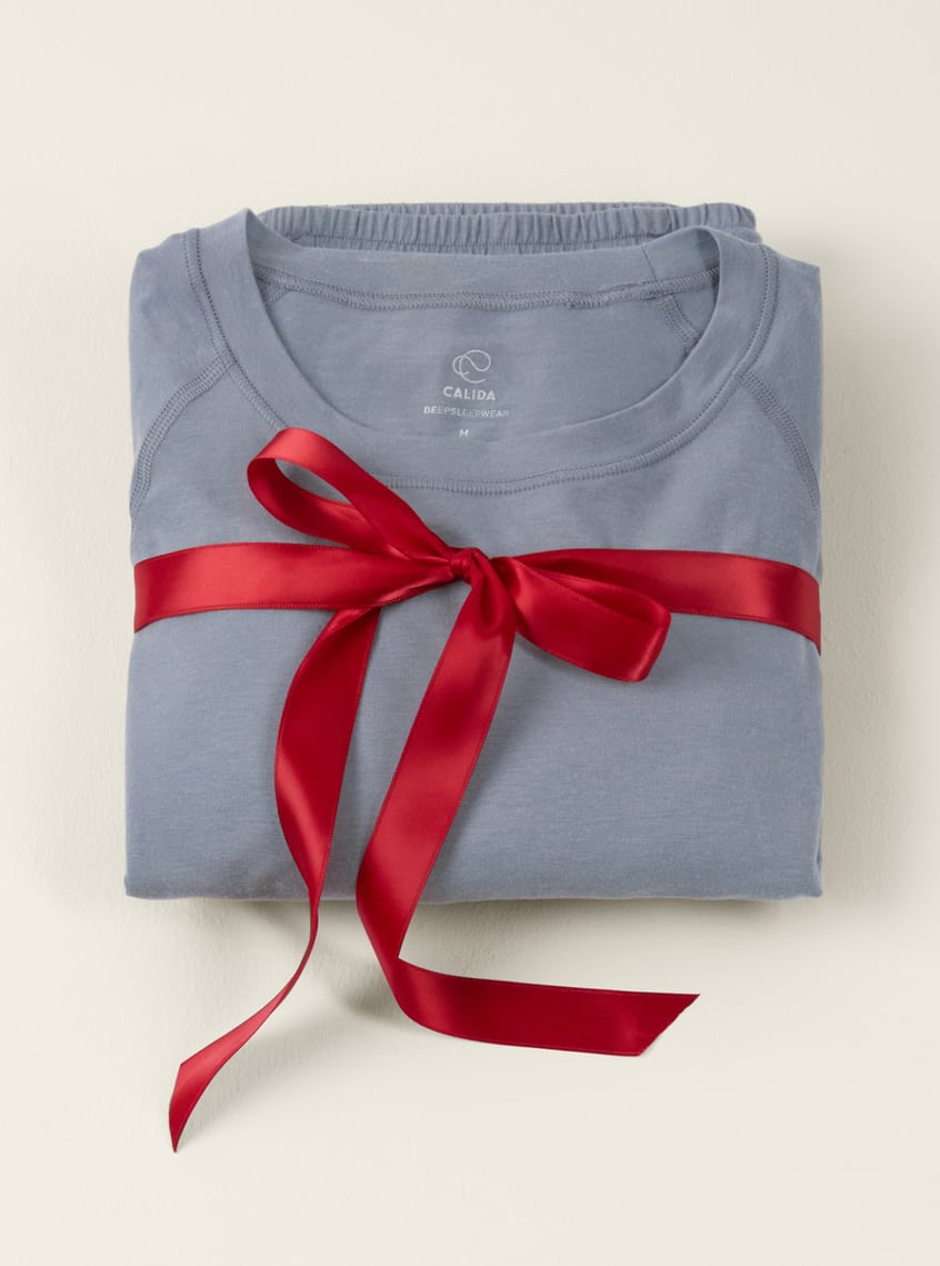 Innovative functional underwear in light blue, presented with a ribbon as a stylish gift idea.