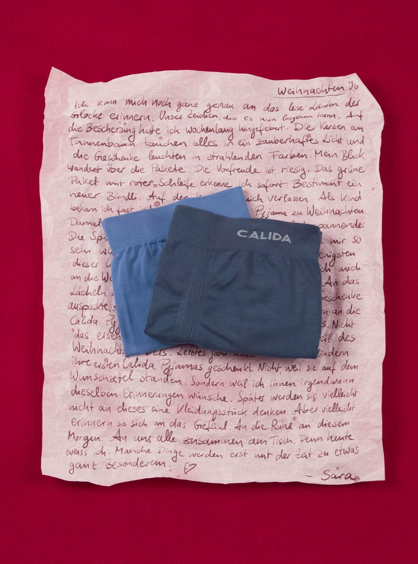 Sporty underwear in blue with an elastic comfort waistband, decorative against a festive background.