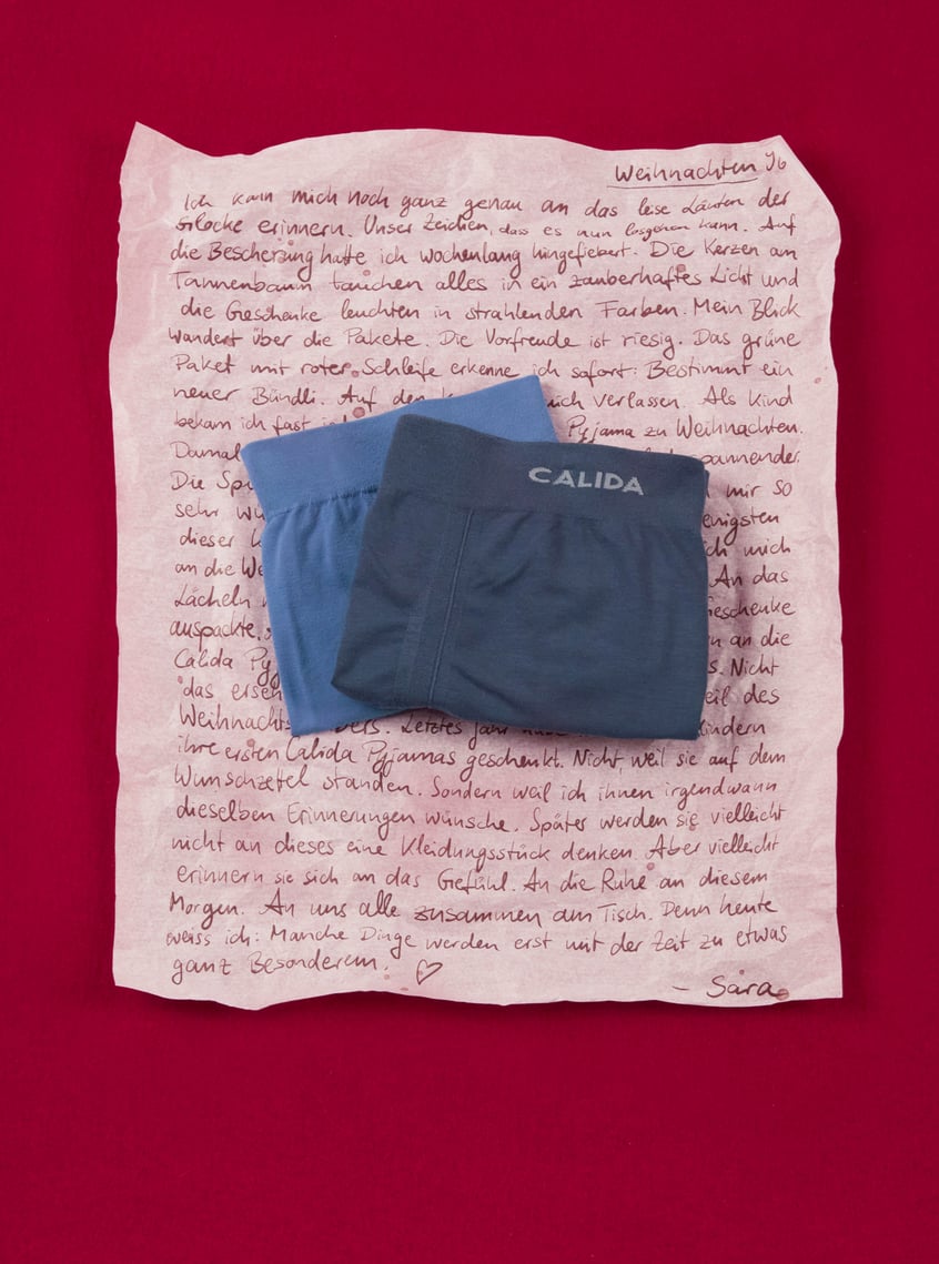 Sporty underwear in blue with an elastic comfort waistband, decorative against a festive background.
