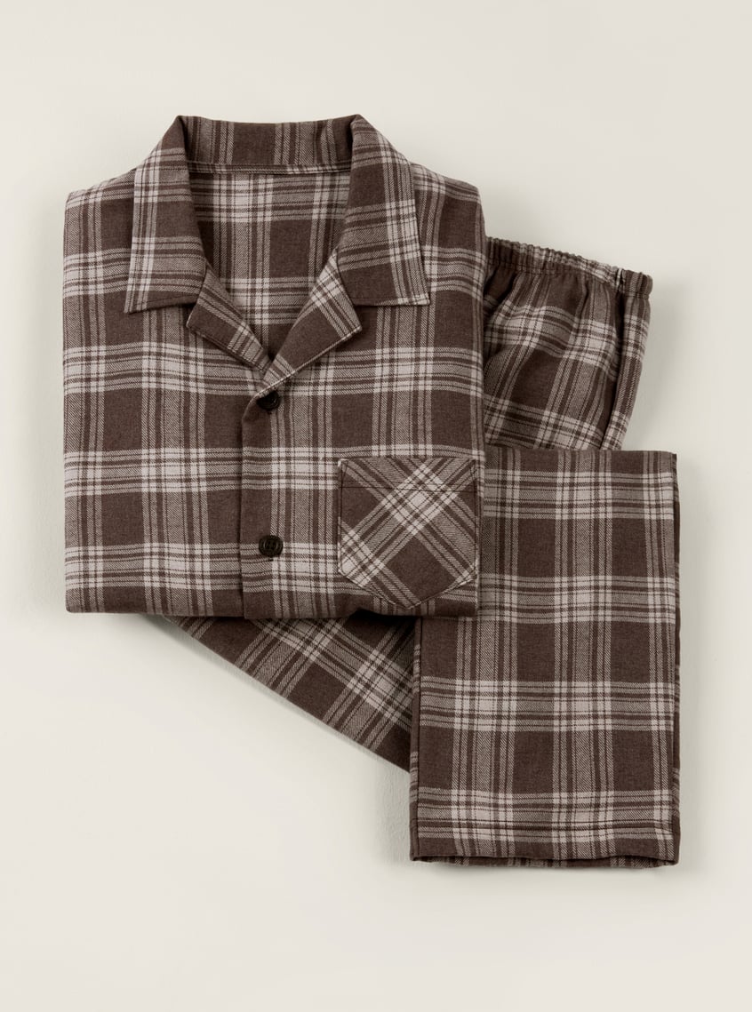 Warming flannel pajamas with a brown checkered pattern, presented as a winter gift idea.