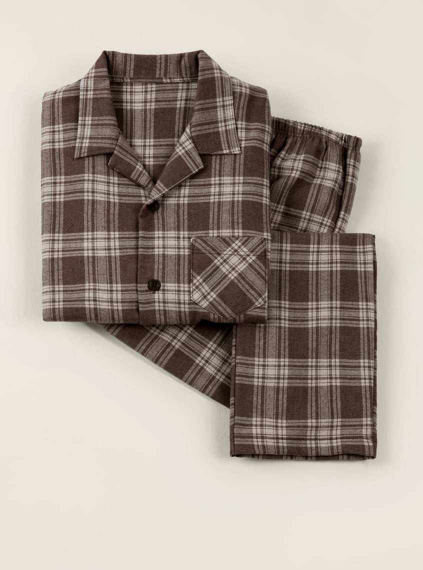 Warming flannel pajamas with a brown checkered pattern, presented as a winter gift idea.
