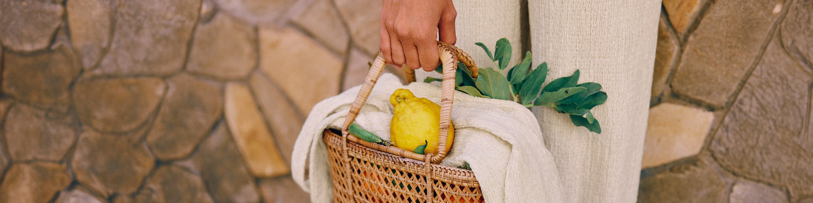 Picture shows a bag with calida nightwear and a lemon on top.
