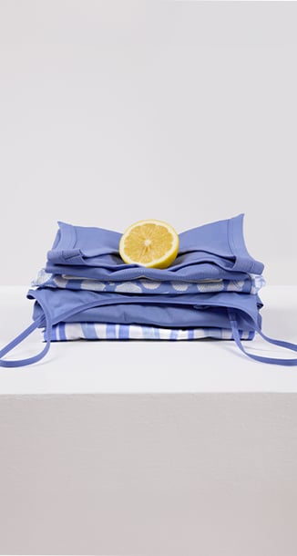 Items from the Favourites Ocean series are folded and placed on a table.