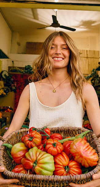 A woman wearing  a pice of the riviera selection.