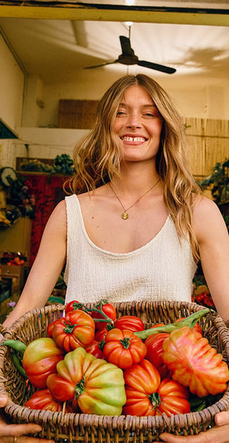 A woman wearing  a pice of the riviera selection.