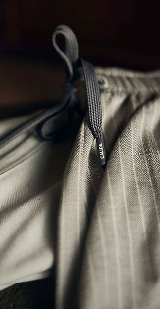 Image of striped pajama pants in dark elegant light.