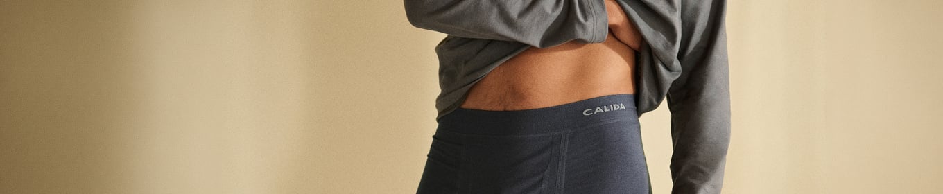 A woman and a man are wearing the new loungewear from the HW26 collection.