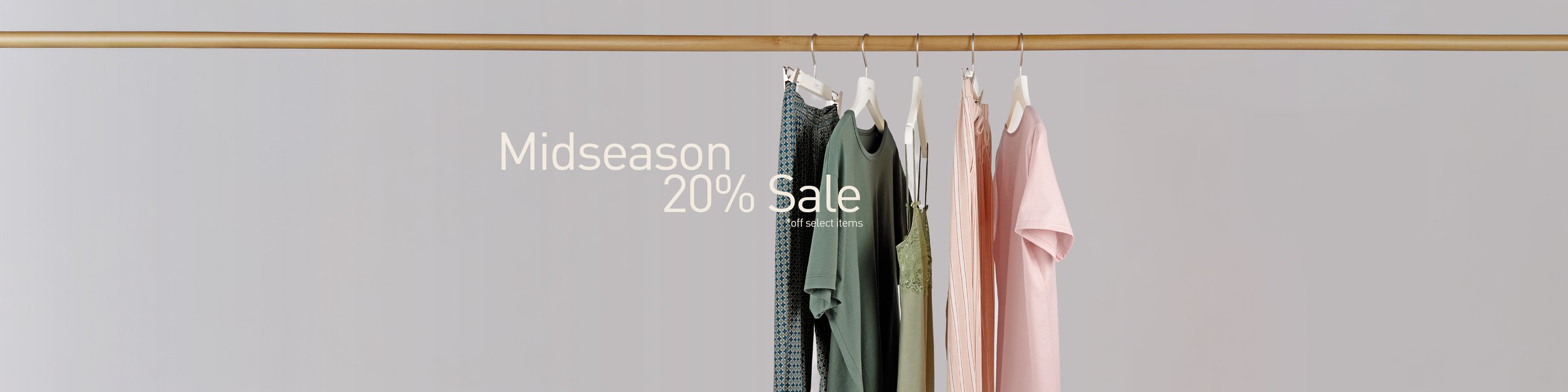 The image shows nightwear and underwear for men and women hanging on a clothes rail.