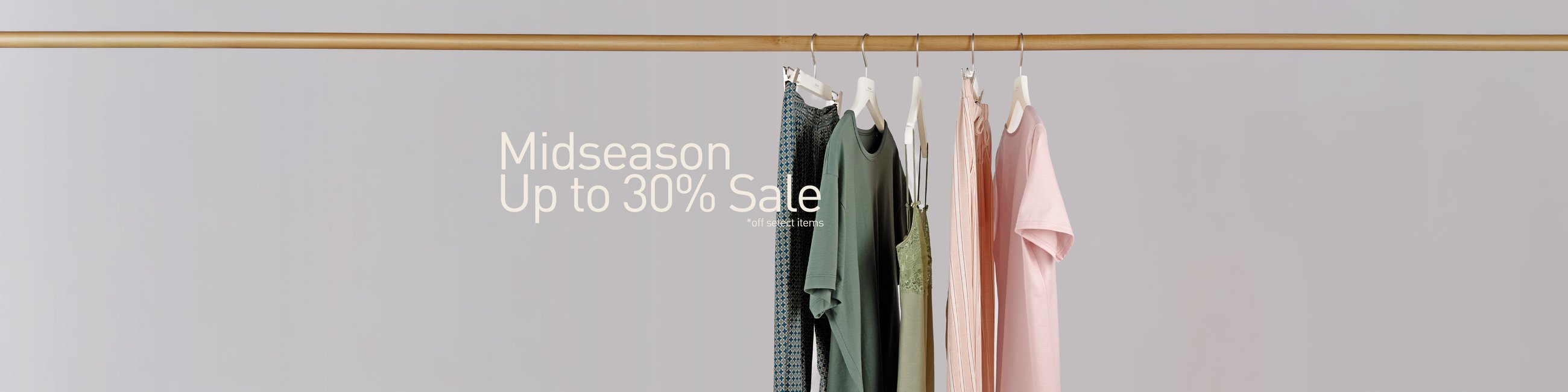 The image shows nightwear and underwear for men and women hanging on a clothes rail.