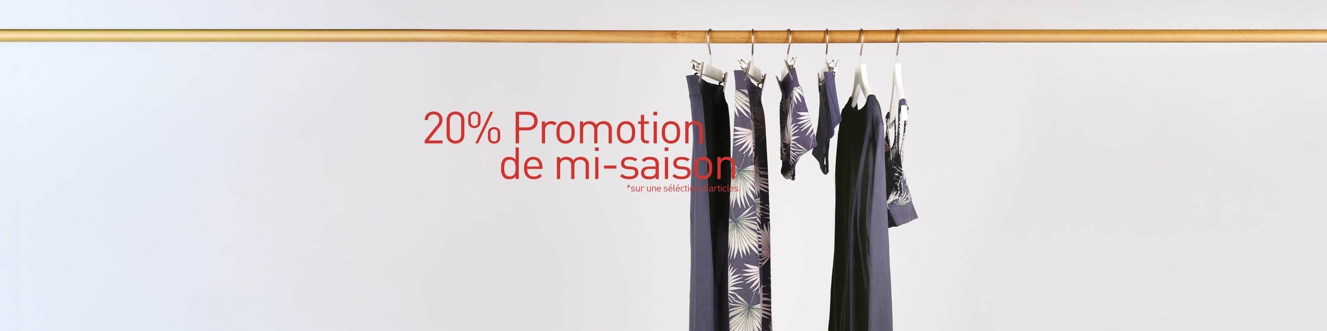 The image shows nightwear and underwear for men and women hanging on a clothes rail.