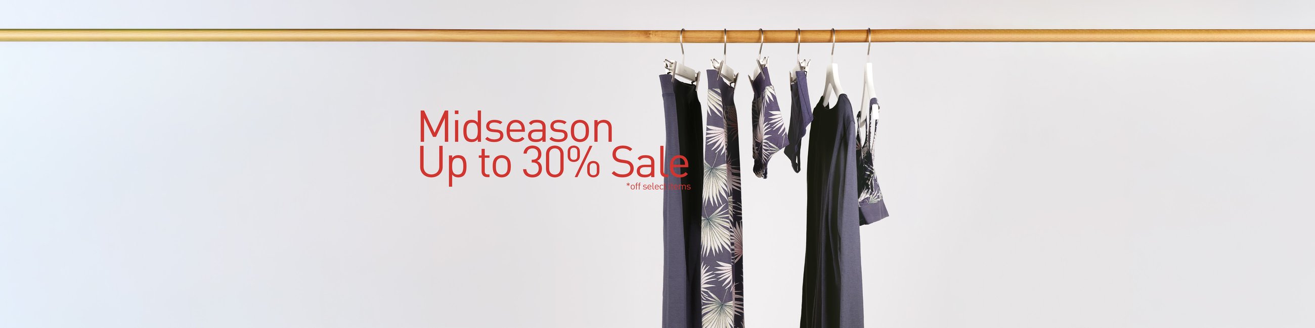 The image shows nightwear and underwear for men and women hanging on a clothes rail.