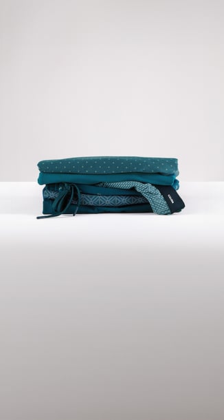 The picture shows a pile of nightwear and underwear.