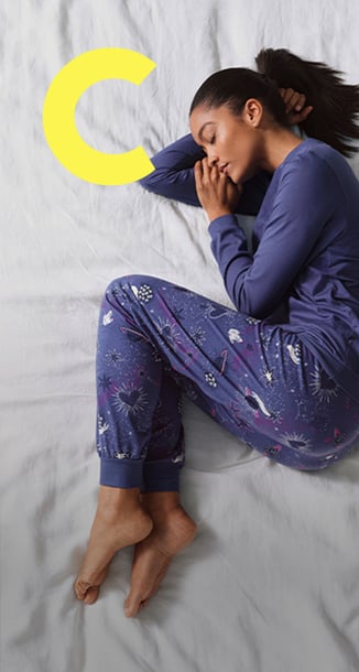 The lady is wearing pyjamas from the Mystic Nights range.