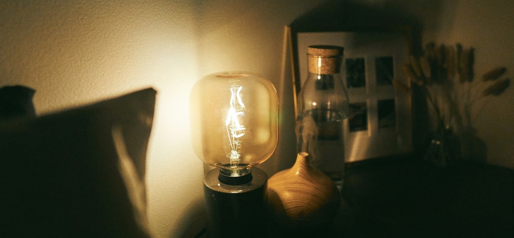 Cosy bedroom with dimly lit lamp