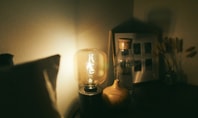 Cosy bedroom with dimly lit lamp