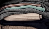 Stacked cashmere jumpers in different colours