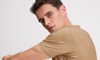 Man wearing beige CALIDA shirt from the Natural Cooling collection – ideal sleepwear for night sweats.
