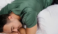 Man sleeping in green CALIDA Deepsleepwear Cooling shirt