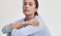 Woman in light blue nightwear from CALIDA’s Basic series Favourites Sleep against a white background.