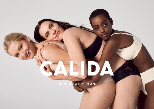 3 women wearing CALIDA underwear and hugging each other. CALIDA lettering with the subtitle ‘Born in Switzerland’.