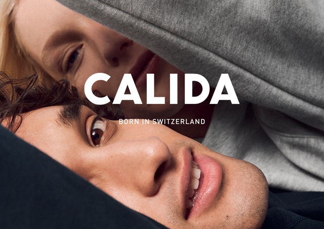A woman and a man look into the camera. A CALIDA logo with the slogan ‘Born in Switzerland’ can be seen.